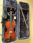 K. Schiller Student Sized 4/4 Violin With Bow And Hard Case. Fixed Price $125.00.