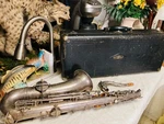 1909 Frank Holton Saxaphone / #6922 Case. Fixed Price $225.00.